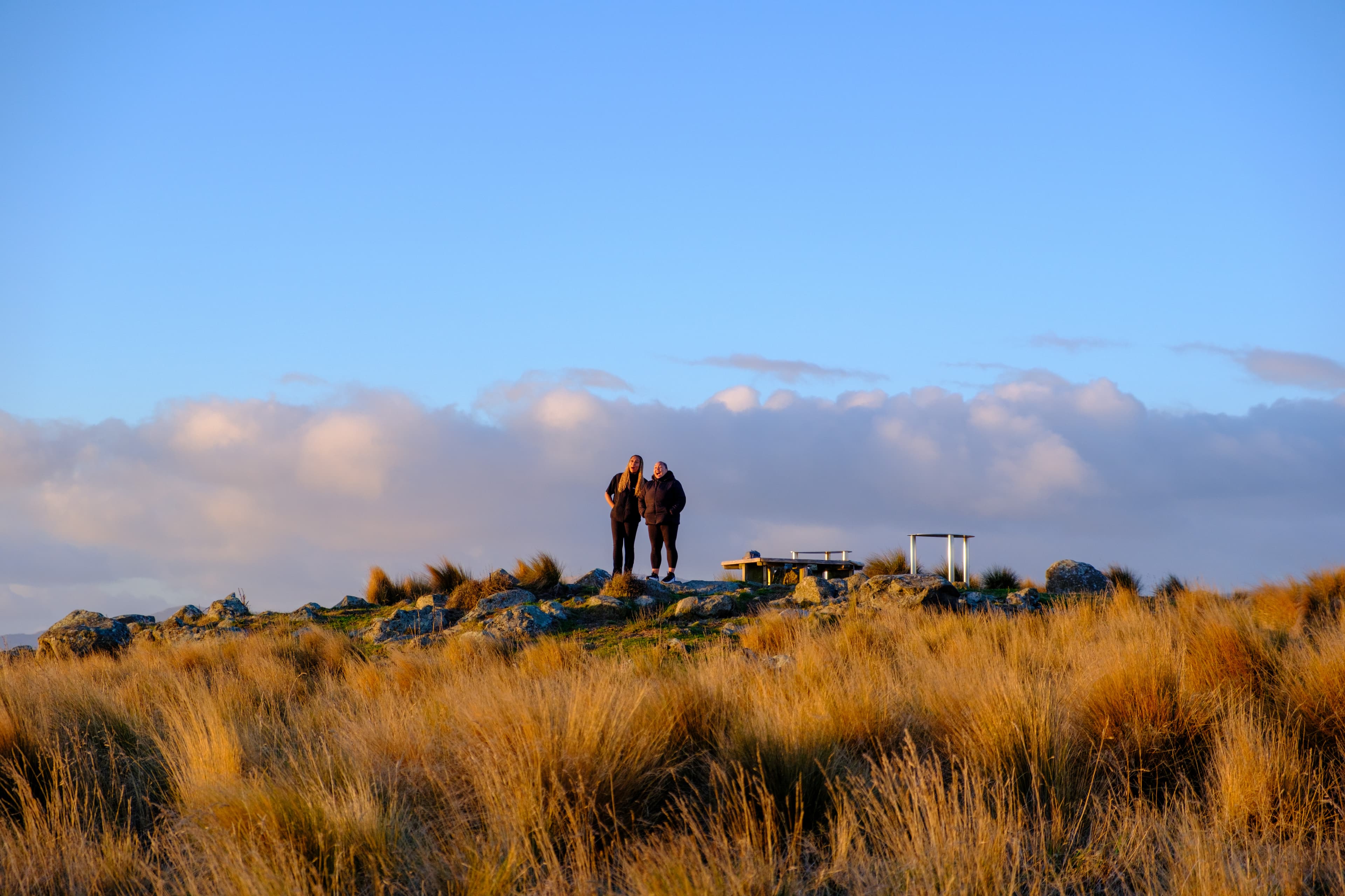 55mm · f/4.5 · 1/500s · ISO 400
FUJIFILM X-T5 · XF18-55mmF2.8-4 R LM OIS · May 25, 2024
Two people on a golden hillside in Christchurch, New Zealand.
Christchurch, New Zealand
© Brandon Cook
