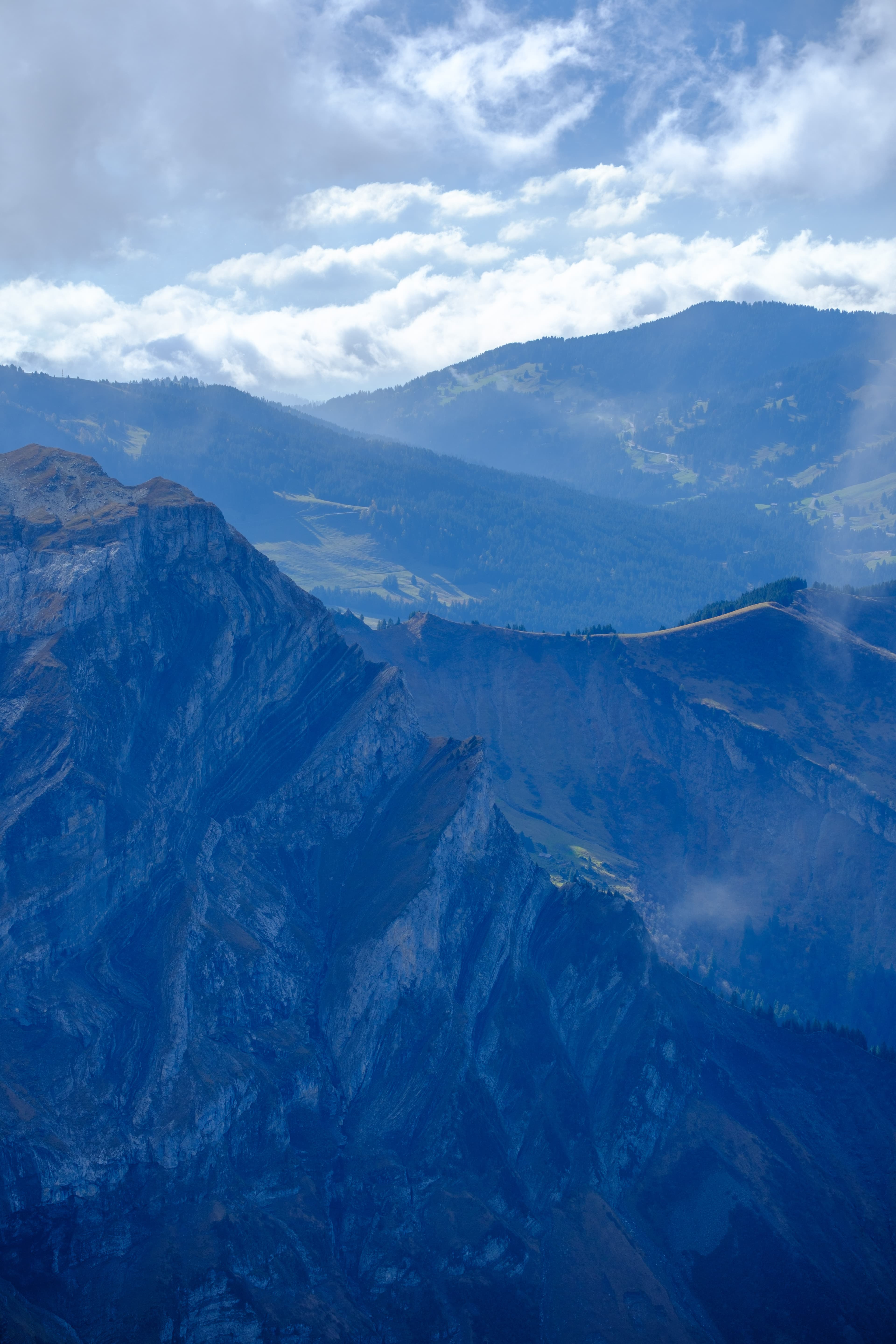 70mm · f/4 · 1/640s · ISO 125
FUJIFILM X-T5 · XF70-300mmF4-5.6 R LM OIS WR · Oct 24, 2024
Rugged blue mountain peaks layered against a cloudy sky.
Saanen, Switzerland
© Brandon Cook