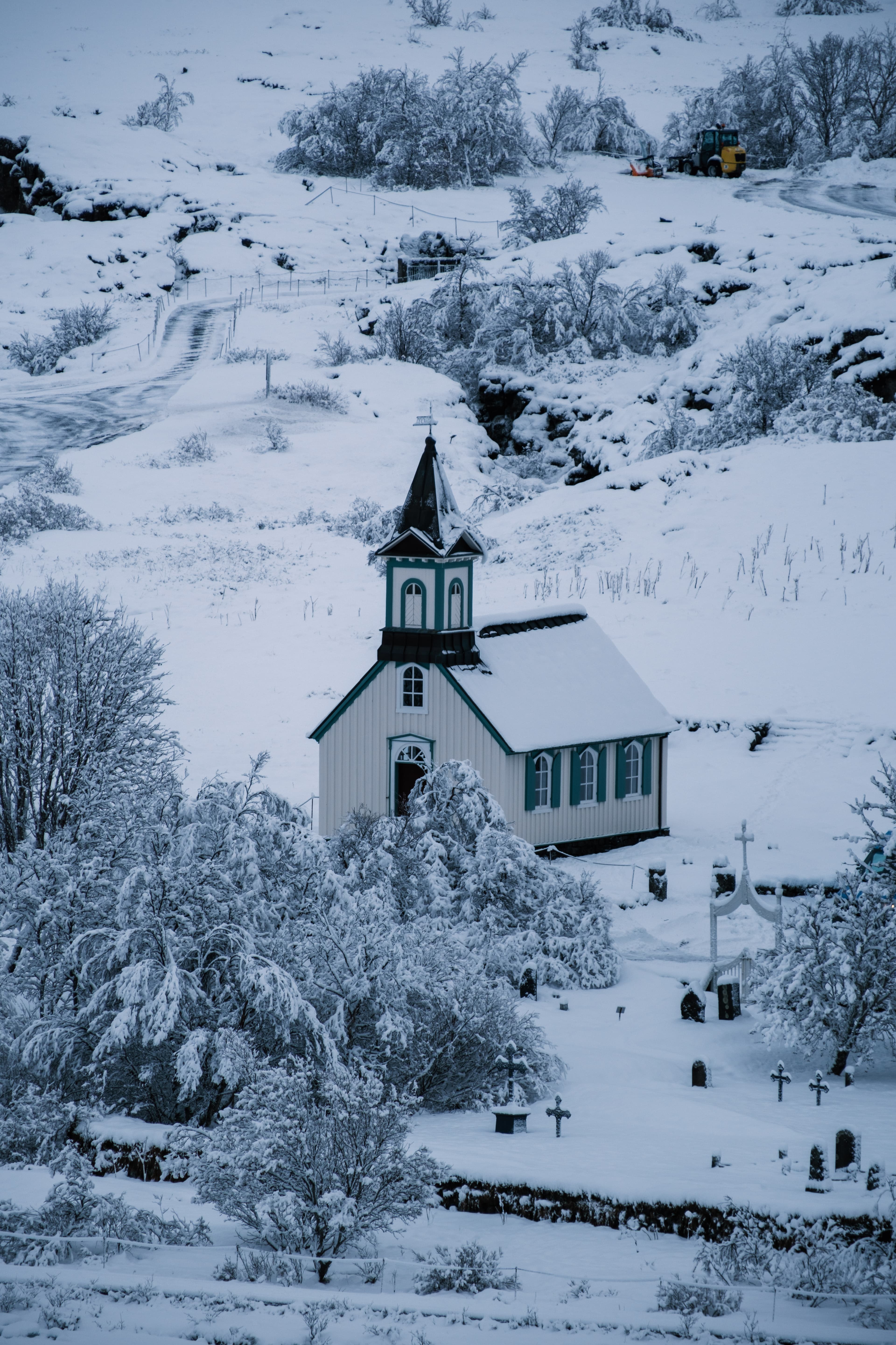 300mm · f/5.6 · 1/280s · ISO 125
FUJIFILM X-T5 · XF70-300mmF4-5.6 R LM OIS WR · Jan 24, 2025
Snowy church and graveyard in a wintry Icelandic landscape.
Selfoss, Iceland
© Brandon Cook